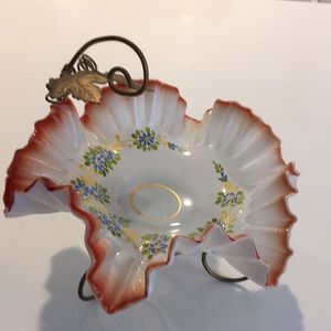Antique ruffled edge collectible candy dish with gold stand.